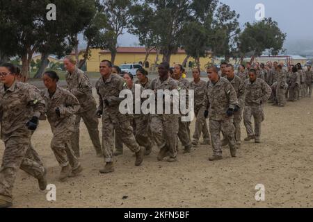 U.S. Marine Corps recruits with Golf Company, 2nd Recruit Training Battalion, run to their next exercise during the combat conditioning course (CCX) at Marine Corps Recruit Depot San Diego, Sept. 28, 2022. The CCX was designed to increase recruits’ stamina and ability to perform Marine Corps Martial Arts Program techniques. Stock Photo