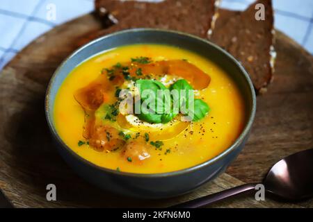 Pumpkin carrot soup with meatballs in a bowl. Autumn menu. Stock Photo