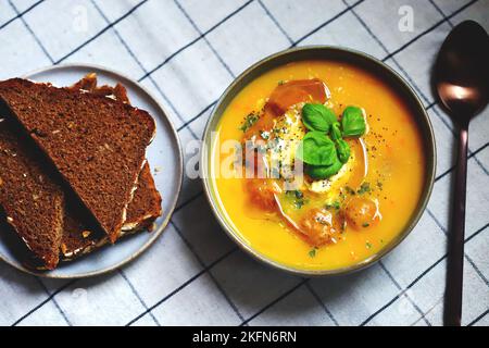 Pumpkin carrot soup with meatballs in a bowl. Autumn menu. Stock Photo