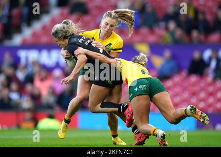 New Zealand's Apii Nicholls is tackled by Australia's Emma Tonegato and Tarryn Aiken during the Women's Rugby League World Cup final at Old Trafford, Manchester. Picture date: Saturday November 19, 2022. Stock Photo