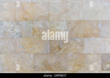The texture of the wall lined with marble tiles Stock Photo