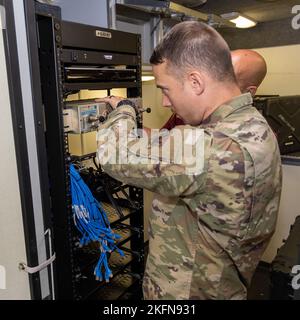 Airmen with the 255th Air Control Squadron, 172nd Airlift Wing, Mississippi Air National Guard, inspect and pack equipment at the Gulfport Combat Readiness Training Center, Gulfport, Miss., September 28, 2022. The Airmen are preparing to deploy to Florida in support of Hurricane Ian recovery. Stock Photo