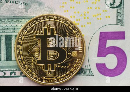 Bitcoin coin on dollar bill closeup Stock Photo