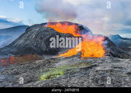 Active volcano on Reykjanes Peninsula. Landscape in Iceland. Lava from the volcanic crater in the day with sunshine. old magma rock at volcanic crater Stock Photo