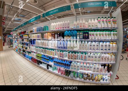 Cuneo, Italy - November 18, 2022: shelves with vast assortment of body care products, bubble baths and creams in Italian supermarket, fish eye vision Stock Photo