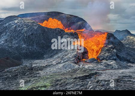 View into an active volcano to the Erupiton. strong lava flow from crater opening. Volcanic craters on Iceland Reykjanes peninsula. vulcano landscape Stock Photo