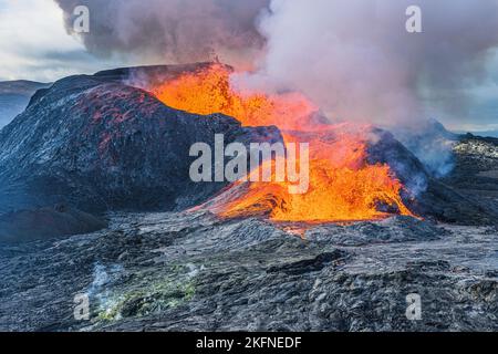 Volcanic landscape in Iceland. active volcano on Reykjanes Peninsula in GeoPark. Volcanic crater during eruption with strong lava flow. glowing lava Stock Photo