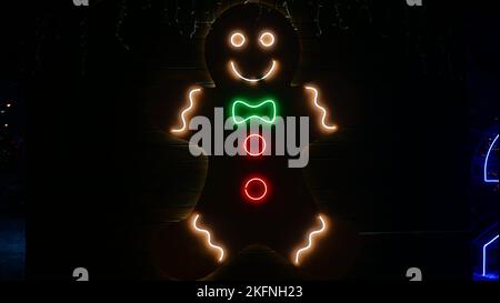 Street Christmas, New Year decoration made of led lamps in the form of gingerbread man. Close-up, in the evening night, outside Stock Photo