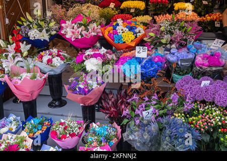 Estonia, Tallinn - July 21, 2022: Closeup of variation of flower bouquets in all kind of colors on market along Viru street. Stock Photo