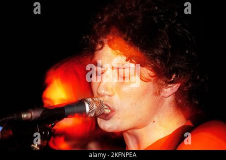 Craig Macintosh (Mackintosh) singer and guitarist with DOGS DIE IN HOT CARS at Cardiff Welsh Club, Wales UK on February 5 2004. Picture ROB WATKINS. INFO: Dogs Die In Hot Cars, a Scottish indie rock band, gained attention in the early 2000s. Their debut album, 'Please Describe Yourself,' showcased a mix of catchy pop melodies and eclectic influences. Despite their short-lived mainstream success, the band left a mark with their energetic and distinctive sound. Stock Photo