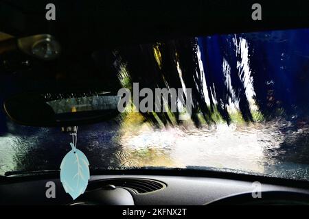 A car wash shot from inside the car being washed Stock Photo