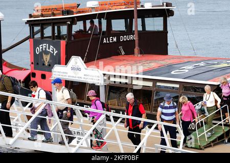 Porto Portugal - visitors and passengers disembark from a tourist river boat cruise on the River Douro in Porto city centre Stock Photo