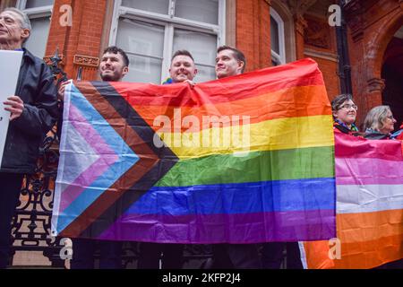 London, UK. 19th Nov, 2022. Protesters hold a pride flag during the demonstration. Activists gathered outside the Embassy of Qatar in London on the eve of the World Cup in protest against the nation's laws and stance on LGBTQ rights and general human rights violations, and FIFA's controversial decision to award the biggest soccer tournament in the world to Qatar. (Photo by Vuk Valcic/SOPA Images/Sipa USA) Credit: Sipa USA/Alamy Live News Stock Photo