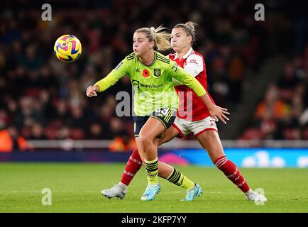 Manchester United's Alessia Russo (left) and Arsenal's Steph Catley battle for the ball during the Barclay Women's Super League match at the Emirates Stadium, London. Picture date: Saturday November 19, 2022. Stock Photo