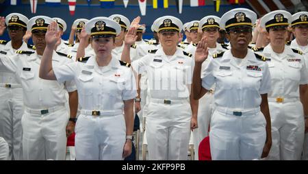 NEWPORT, RI. (Sept. 30, 2022) Officer Development School (ODS) class 22080 students at Officer Training Command Newport (OTCN), reaffirm the oath of office during their graduation ceremony, Sept. 30, 2022. ODS provides staff corps officers and several restricted line designators with training necessary to prepare them to function in their role as newly commissioned Naval officers. Stock Photo