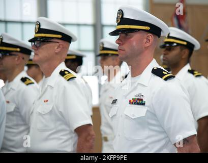 NEWPORT, RI. (Sept. 30, 2022) Officer Development School (ODS) class 22080 students at Officer Training Command Newport (OTCN), stand at attention during their graduation ceremony, Sept. 30, 2022. ODS provides staff corps officers and several restricted line designators with training necessary to prepare them to function in their role as newly commissioned Naval officers. Stock Photo