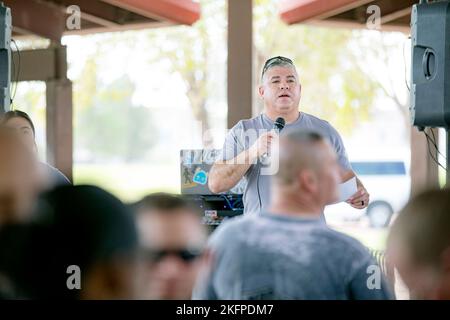 Command Sgt. Maj. Gerardo Gonzalez, the U.S. Army Garrison Fort Bliss command sergeant major, greets the crowd during the opening of the 2022 B.O.S.S. Bash at Fort Bliss, Texas, Sept. 30, 2022. As a Garrison Directorate of FMWR initiative, the garrison sergeant major has a special role as the installation B.O.S.S. program’s primary advocate. Gonzalez was born in El Paso, Texas, and grew up in nearby Anthony, N.M. Stock Photo