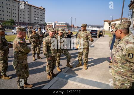 The command team from 311th Signal Command, which included Brig. Gen. Kevin Meisler and Command Sgt. Maj. Jonathan DeHart visited the 41st Signal Battalion and had the opportunity to to recognize and give coins to some soldiers there. Stock Photo