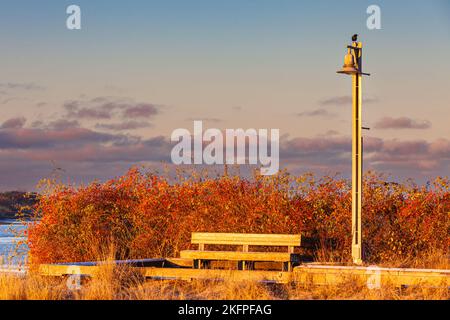 Early morning light on a vacant bench in Steveston British Columbia Canada Stock Photo