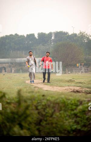Indian young kids walking in the garden Stock Photo