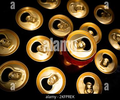 Abstract pattern of opened aluminium cans, top view. Excess drinking, consumerism, alcoholism, or be different concept Stock Photo