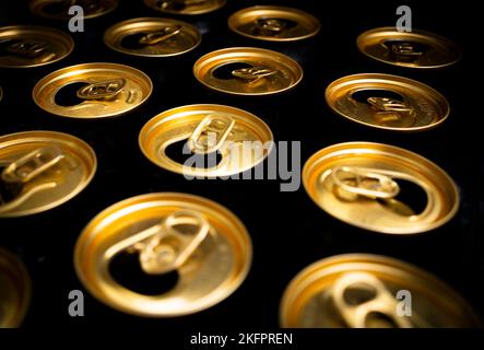 Abstract pattern of opened aluminium cans, top view. Excess drinking, consumerism Stock Photo