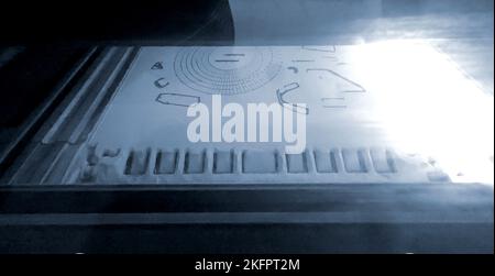 3D printer printing process. High-speed printing of an object on a 3D printer from powder close-up. Creation of a three-dimensional volumetric model on a 3D printer. MJF printing additive technology. Stock Photo