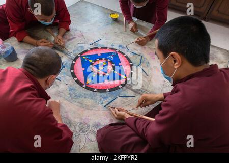 Young monks from Shechen Tennyi Dargyeling Monastery create a sand mandala. Kathmandu. Nepal. Stock Photo