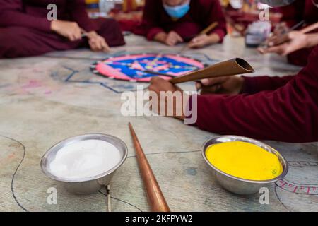 Young monks from Shechen Tennyi Dargyeling Monastery create a sand mandala. Kathmandu. Nepal. Stock Photo
