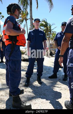 Vice Adm. Kevin E. Lunday, commander, Atlantic Area, speaks with Coast Guard personnel assigned to the Gulf, Atlantic and Pacific Strike teams in Matlacha Isles, Florida, Oct. 2, 2022. Lunday visited members who responded in the wake of Hurricane Ian. U.S. Coast Guard photo by Petty Officer 3rd Class Ian Gray.