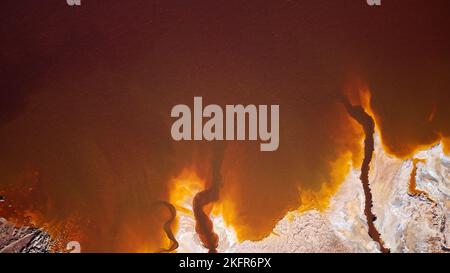 Aerial view of Mining activity. Polluted river and water. Apocalypse scenery. Abstract. Earth and destruction of nature. Extracting natural resources. Stock Photo