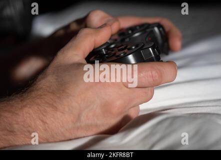 holding a game controller close up Stock Photo