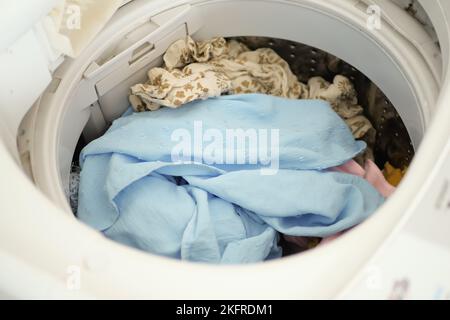 close up of cloths in a washing machine. Stock Photo