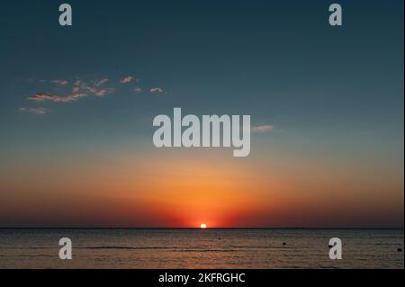 Sunset on sea. Surface on sunset. Water background Stock Photo