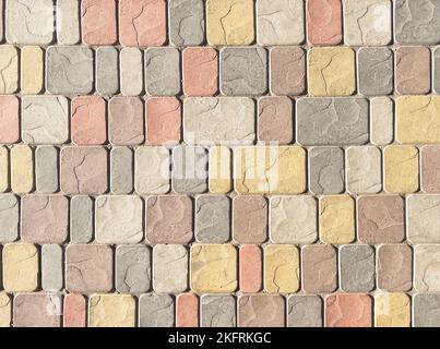 Sidewalk tiles. Closeup of paving slabs background. Street paving slabs. Cement block of the road. Cement brick squared stone floor background. Stock Photo