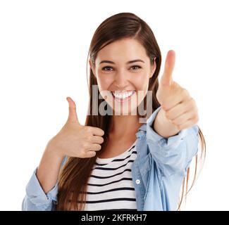 You got it. Studio shot of a beautiful young woman giving you thumbs up against a white background. Stock Photo