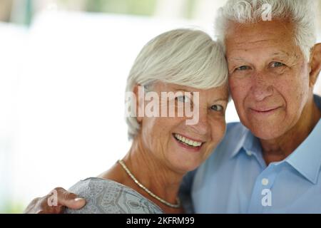 A successful marriage requires falling in love every day. a happy senior couple smiling at the camera. Stock Photo