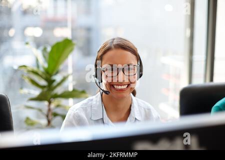Excelling in her sales career. Portrait of a female customer service representative at her computer. Stock Photo