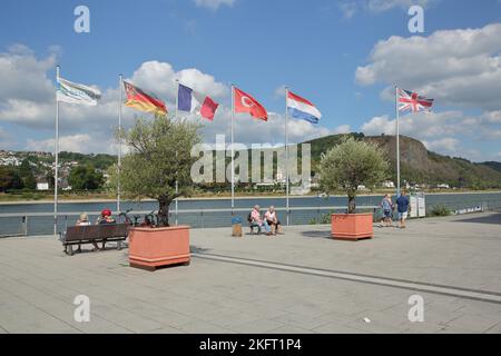 View from the banks of the Rhine with national flags and people in Unkel on Erpeler Ley, Erpel, Rhineland-Palatinate, Upper Middle Rhine Valley, Germa Stock Photo