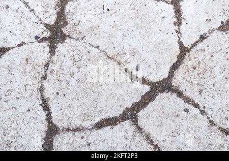 Texture. Cracked texture of white painted asphalt. View from above Stock Photo