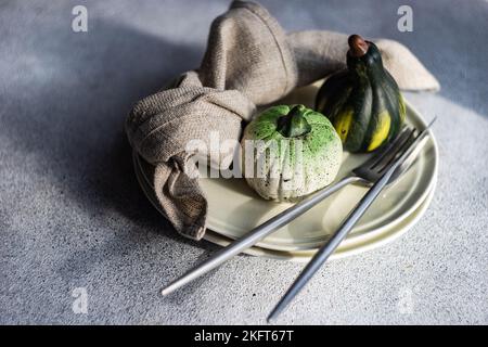 Festive place setting for autumnal dinner with holiday seasonal decoration Stock Photo