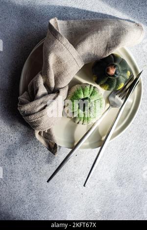 Festive place setting for autumnal dinner with holiday seasonal decoration Stock Photo