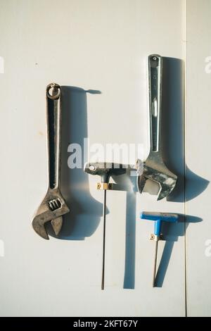Top view of different carpentry tools placed on wooden counter in workshop during daytime Stock Photo