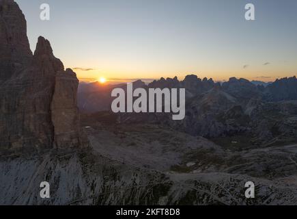 Picturesque view of majestic Dolomite Alps covered with snow during sundown in evening Stock Photo