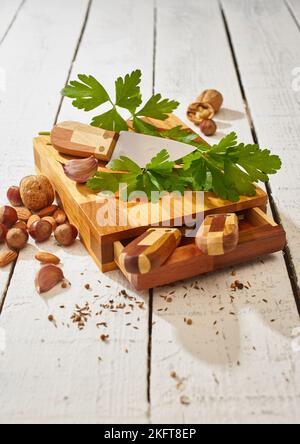 Ripe green parsley and sharp knife on wooden cutting board set Stock Photo