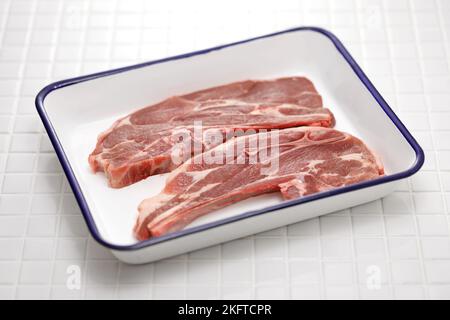 raw lamb shoulder chops on a butcher tray Stock Photo