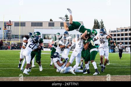 Hornet Stadium. 19th Nov, 2022. U.S.A. Sacramento State quarterback Asher O'Hara (10) jumps over the pile for a touchdown during the NCAA Causeway Classic Football game between UC Davis Aggies and the Sacramento State Hornets. Sacramento State beat UC Davis 27-21 at Hornet Stadium. Thurman James/CSM/Alamy Live News Stock Photo
