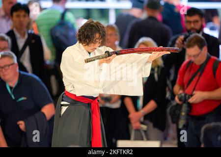 COLOGNE, GERMANY - CIRCA SEPTEMBER, 2018: Samurai Sword Show at Sony stand in Photokina. Stock Photo