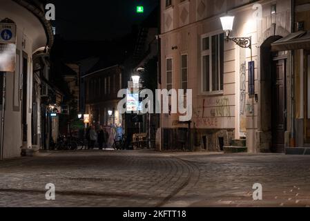 Scenic abandoned alley Trubarjeva in the city center of Ljubljana at night, Slovenia Stock Photo