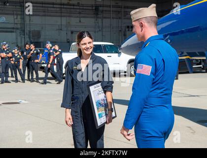 OAKLAND, California (Oct. 07, 2022) Navy Flight Demonstration Squadron, the Blue Angels' advance pilot and narrator, Lt. Cmdr. Griffen Stangel speaks with Monica Barbaro, Top Gun: Maverick actress. The Blue Angels perform flight demonstrations at 32 locations across the country to showcase the teamwork and professionalism of the U.S. Navy and Marine Corps to the American public. Stock Photo